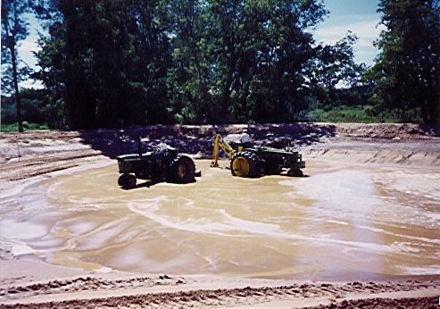 John Deere Tractors Digging a Pond